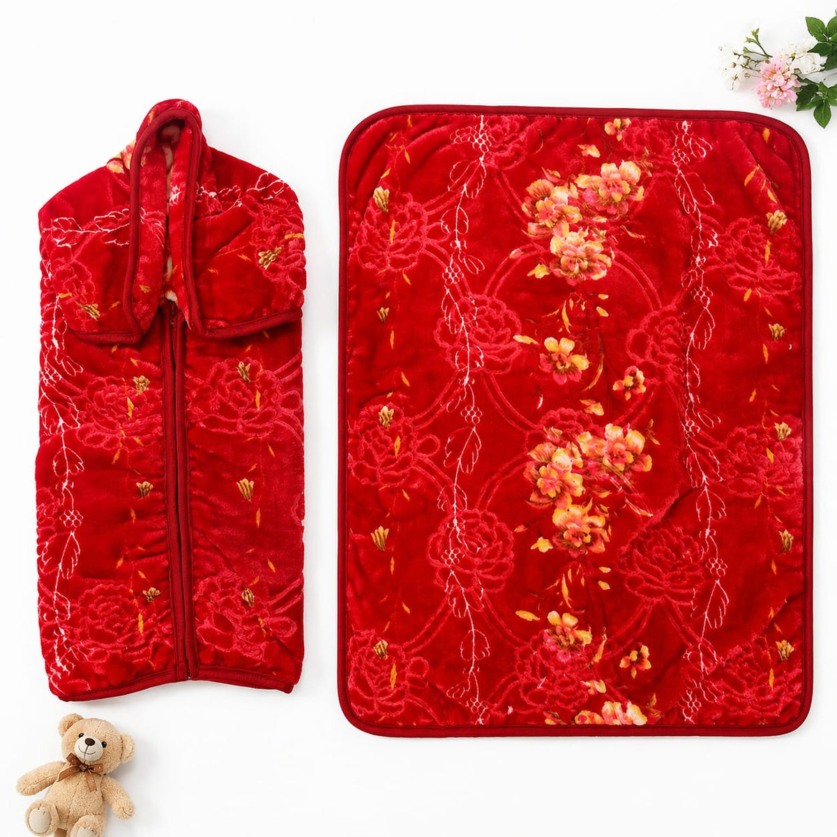 A red quilted embroidered garment bag and matching rectangular cover, both decorated with floral and knot-like embroidery, shown on a white background with a small teddy bear and flowers as props.