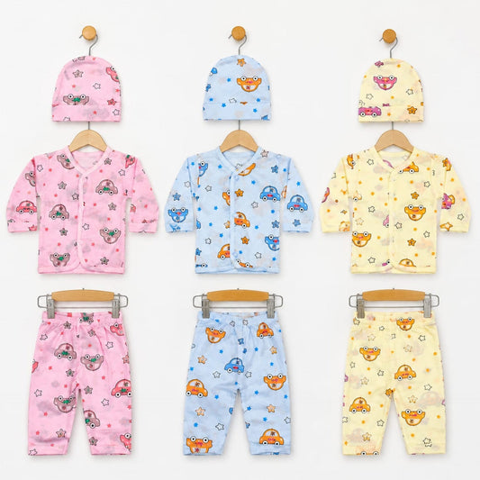 Six baby clothing sets displayed on wooden hangers against a white background, each set including a hat and matching outfit in pink, light blue, or pale yellow. The garments feature playful cartoon patterns of cars, stars, and mushrooms.