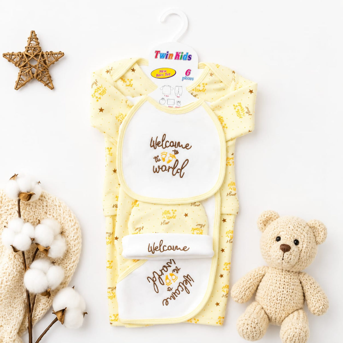 A baby gift set from Twin Kids featuring a yellow short-sleeve romper and matching bib set with 'Welcome to the world' and 'Jr. & Miss.