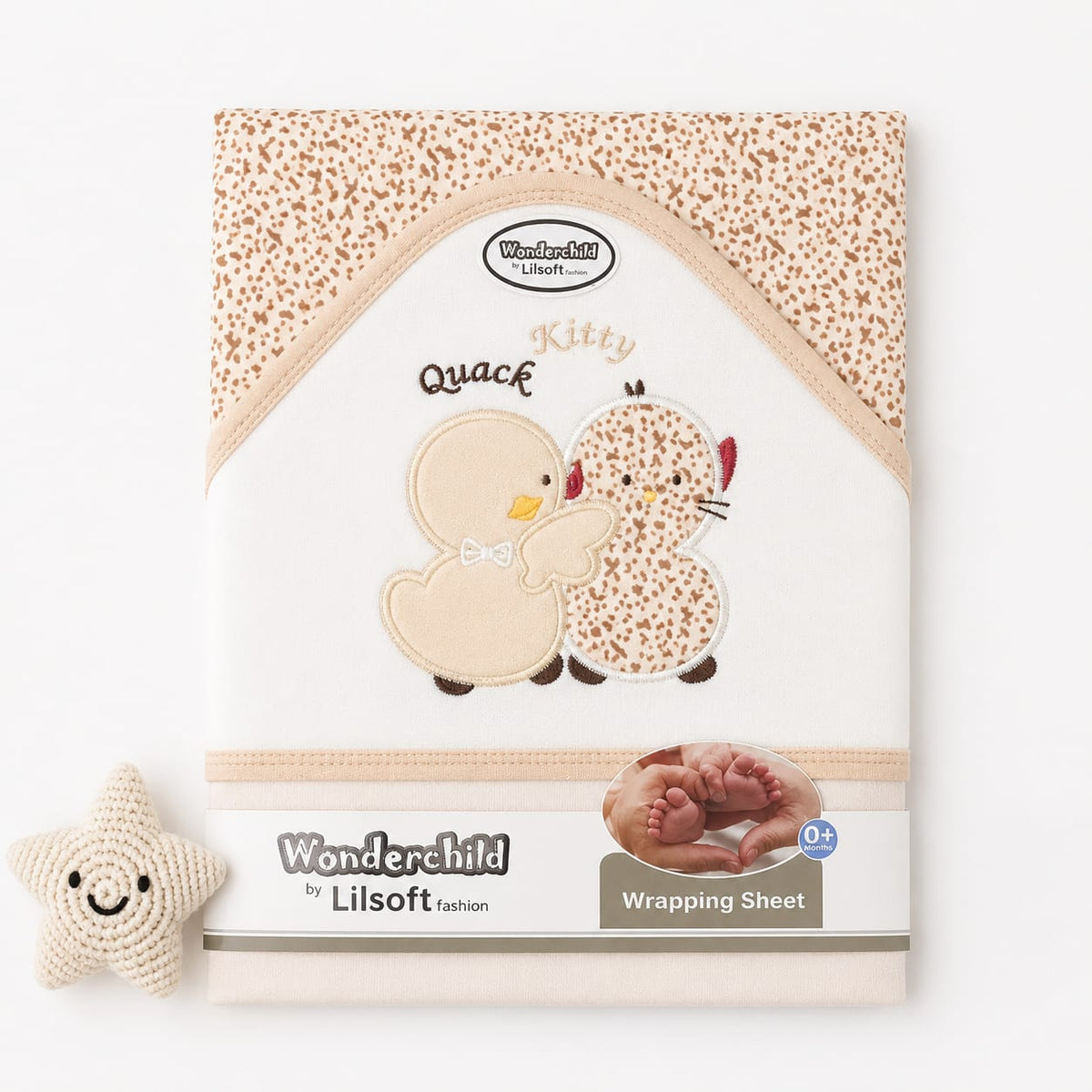 Wonderchild by Lilsoft kitten-themed wrapping sheet with a beige and brown spotted pattern, featuring embroidered cartoon kittens, on a white background with a small crochet star toy.