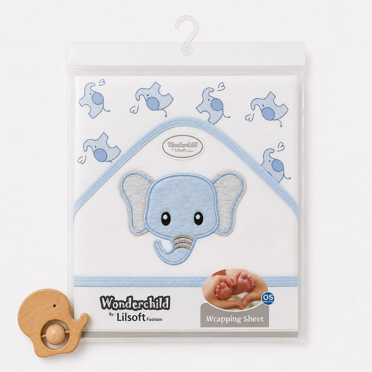 Wonderchild by Lilsoft Fashion baby wrapping sheet in a clear plastic hanging package, featuring a light blue elephant applique on a white background with blue elephant motifs. A small wooden elephant toy is placed at the bottom left on a clean white back